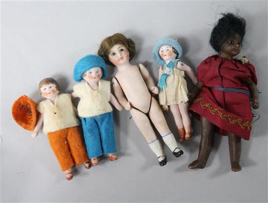 A collection of bisque miniature dolls